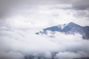 Fototapeta premium Mountain peak on a cloudy sky. Summer weather in the Peruvian Andes, south of Arequipa. Horizontal image.
