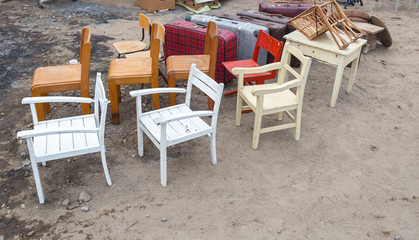 Fototapeta na wymiar Different Vintage Wooden Chairs at Flea market