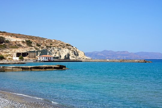 View of the beach and small harbour near Ammoudara, Crete.
