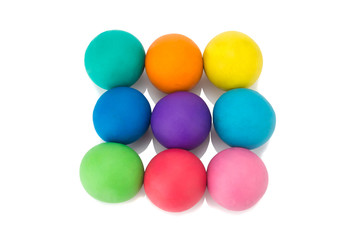 plasticine clay colorful ball rainbow on white background closeup