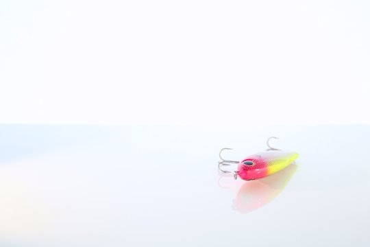 Red and Yellow Fishing Lure Isolated on White Background