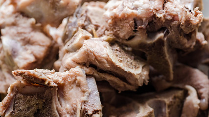 Beef boiled meat with bones. Background texture. Close-up