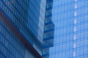 Modern skyscrapers with window reflections of blue sky