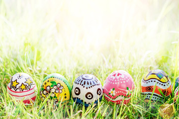 Colorful Egg on Green Grass bokeh For  Easter Background