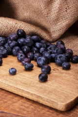 Split blueberries on a rustic wooden background