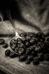 Blueberries and spoon on a rustic background