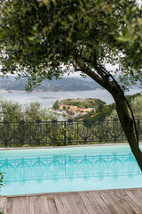 Swimming pool on a hillside overlooking Le Grazie and the Mediterranean.