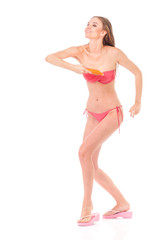 Obraz premium Happy young woman in a bikini with flying disc, isolated on white background 