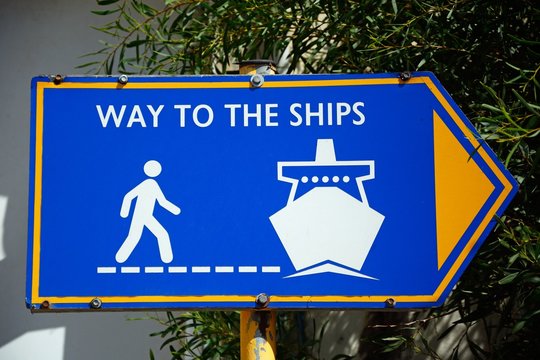 Blue way to the ships sign in the port, Heraklion.
