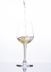 Pouring beer into wine glass Isolated on white background