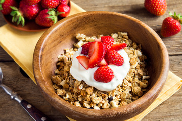 Homemade granola with yogurt and strawberries