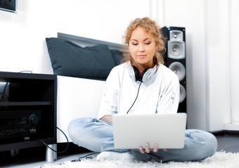 Woman sitting on the floor with laptop