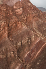 Orange colored canyon wall, covered by volcanic ash in Peru.