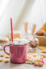 a delicious Cup of cocoa with marshmallows and straws