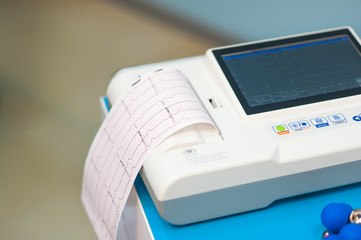Electrocardiogram, cardiac cardiograph and conduct research in pediatrics, a girl doing an electrocardiogram