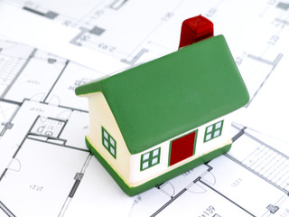 Miniature houses mortgage and real estate investment or property insurance