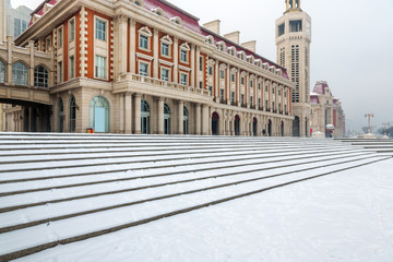 Fototapeta premium Modern building exterior and empty square floor in city of China.