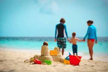 sand castle on tropical beach, family vacation