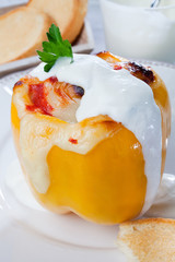 Yellow stuffed pepper with chicken meat dressing with cream