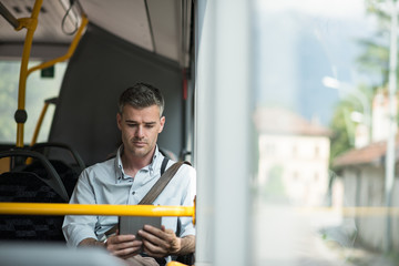 Businessman traveling by bus
