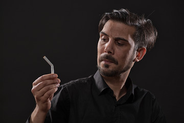 Portrait of adult man who is decided to quit smoking.