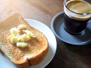 Hot coffee and bread in holiday morning.