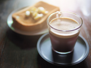 Hot coffee and bread in holiday morning.