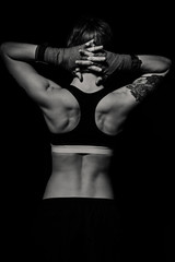 Fototapeta na wymiar Beautiful muscular back of a boxer woman