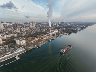 Naklejka premium Thermal power plant on the river shore. Aerial view.