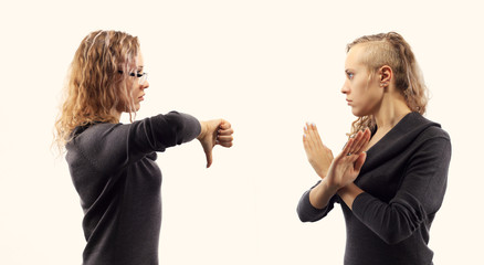 Self talk concept. Young woman talking to herself, showing gestures. Double portrait from two different side views.