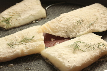 Thymus and flat fish on frying pan