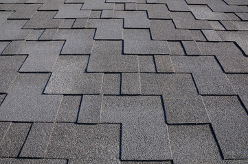 Close up view on Asphalt Roofing Shingles Background. Roof Shingles - Roofing.