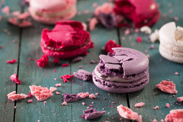 Colorful macaroons on wooden table. Sweet macarons. French desert
