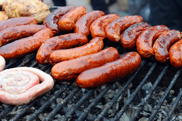 Fresh grilled sausages and welts in heap. Heap of Fresh sausage. Fresh grilled sausages and welts...