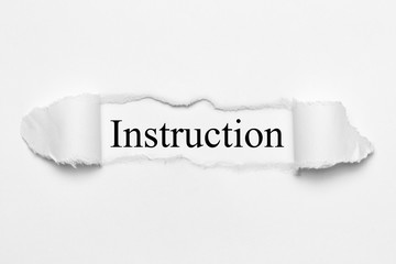 Instruction on white torn paper