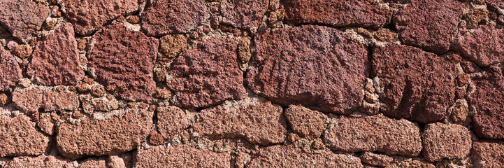 Red natural stone wall background