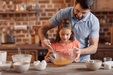 'portrait of father and daughter making cookies in kitchen - obrazy, fototapety, plakaty