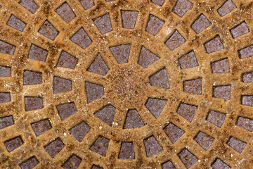 old rusty metal drain cover, brown texture