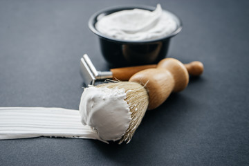 mens shaving kit on black background