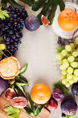 Food Background with Colorful Fruit and Wooden Board