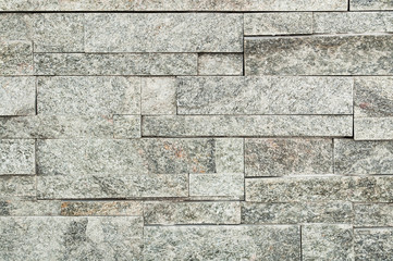 Grey stone wall tiles texture.wall pattern design or abstract background.