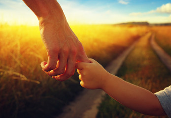 hands of the parent and litlle child