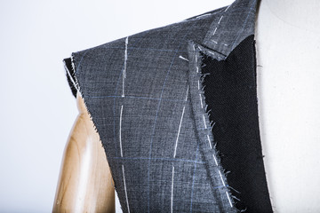 Details of a tailored suit jacket