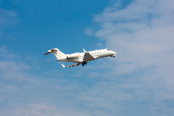 Taking off the business jet and retracting the landing gear
