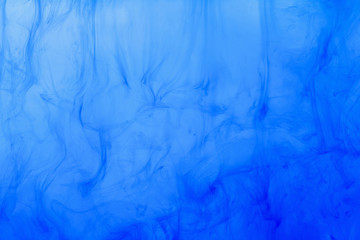Blue smoke abstract background. Color ink or paint drop in water.