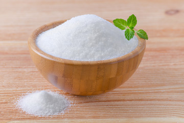 birch sugar xylitol in a wood bowl with mint on wooden
