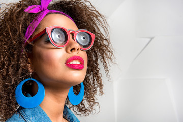 Serious young woman dressing accessory