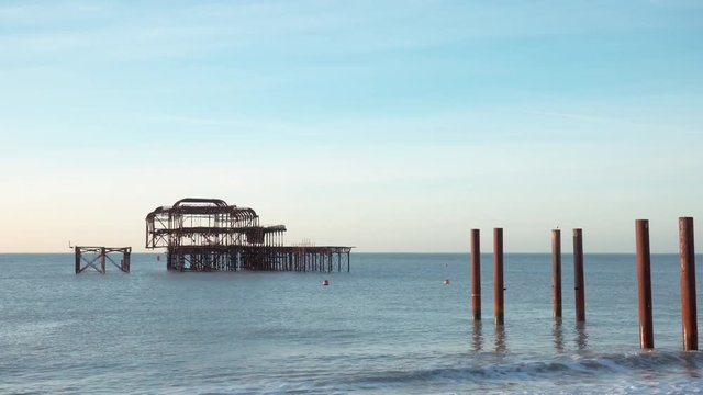 Hyperlapse (motion time lapse) of the old West Pier in Brighton, England (Sussex). Beautiful early winter morning at the end of December.