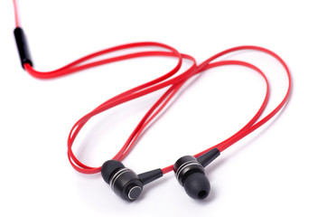 Red earphones on a white background