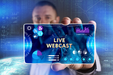 Business, Technology, Internet and network concept. Young businessman showing a word in a virtual tablet of the future: Live webcast